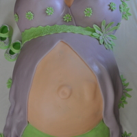 Pregnant Belly Chocolate belly, vanilla breasts, buttercream, covered in mmf. flowers and baby shoes are mmf and tylose powder.