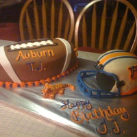 Aurburn Football And Helmet Cake It took me two days to make this but it turned out great. This was my first real attempt at sculpting a cake. Football is made out of three...