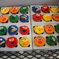 Sesame Street Cupcakes Chocolate & Vanilla cupcakes with buttercream icing. The eyes are marshmallows cut in half.