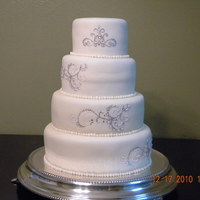 My Very First Wedding Cake This is my ver first wedding cake.. I was so upset when my hubby pushed the dowel thru and it buckled the second tier! :( But I think that...