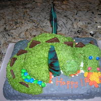 Dragon Cake Made for my nephews 11th Birthday. Made with two 9" round marbled chocolate and yellow cakes, a cupcake and one sheet cake....