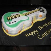 Guitar Birthday Cake This cake was done using the Wilton guitar pan. I made it for a friend's 14 year old grandson who plays the electric guitar. It is 2...