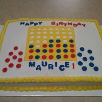 Connect Four Done for church member who's son likes Connect Four. Iced in buttercream, fondant accents