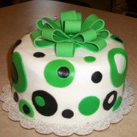 Bow And Dots Bday Bday cake done for a friend. Strawberry cake with buttercream icing. Fondant accents. Bow made of fondant and gum paste