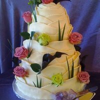 A Cake That Blooms This five-tier chocolate cake is surrounded by layer after layer of white modeling chocolate!