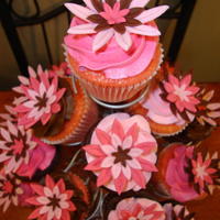 Pink And Brown Flower Cakes I made these for a little girl's birthday. I did a 6" cake for the birthday girl and cupcakes for her guests. The flowers are a...