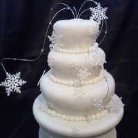 Snowflakes This cake was made for a childrens charity auction, the three tiers are fruit cake, then covered in marzipan and fondant with modelling...
