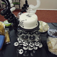 Black & White 18Th Birthday White chocolate and lemon cupcakes and white chocolate chip top tier cake, iced and decorated in fondant and gumpaste.