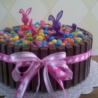Easter Candy Barrel Cake Two layer carrot cake, butter cream frosting. Jellybeans on top and kit kats rim the cake, huge hit!