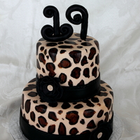 Leopard Print Birthday! I made this cake for my sister's 19th birthday. 9" and 6" cake. All fondant with hand painted leopard print. Flower is...