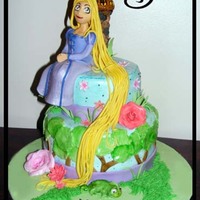 Disney's Tangled Cake This cake is based off of Disney's Tangled. Made for a little girl with bright colours!