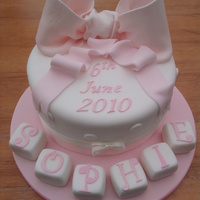 Christening Cake Christening cake for Sophie. This was my first attempt at a bow!!!! Trust me to choose such a big one.