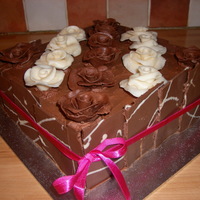 Chocolate Roses Birthday Cake my firt attempt at working with chocolate, I made my own chocolate modeling paste, then made the roses with it. I also made the oblongs for...