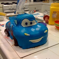 Blue Race Car This was my first time carving a cake and working with fondant. I was short on time and it was late, so the details are not up to standard...