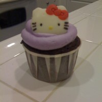Hello Kitty Cupcakes These are purple velvet Hello Kitty cupcakes with a cream cheese frosting. The Hello Kitty chocolates on top are made of candy melts.