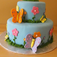 Flower And Butterflies This was a pratice cake I done for my cake class,cake is covered in MMF fondant with fondant butterflies and flowers.