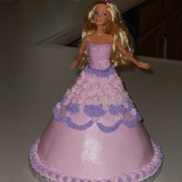 Barbie Cake Carved from two 8 inch cakes and 1 6 inch cake. buttercream skirt. fondant bodace