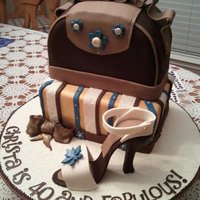 2 Tier Louis Vuitton Style Purse Cake With Stiletto Shoe Strawberry Cake/French Vanilla BC, covered in fondant. My first purse and first shoe. Lot's of work, but lot's of fun, too. Shoe...