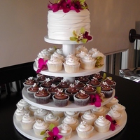 Orchid Wedding Cupcake Tower 6" Vanilla cake with strawberry filling and vanillabean buttercream. This was my first try layering the fondant, next time I will roll...