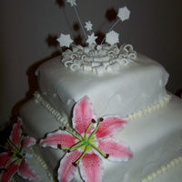 Winter Wedding Cake My interpretation of the Wilton Snowflake Dance Cake. Hand made stargazer lilies. Thank you for looking