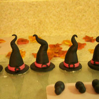 Halloween Cupcakes I made these for my kids halloween parties. The kids LOVED them. I had inspiration for the hats from many other CCers. Thank you!