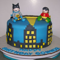 Batman And Robin Tiny Titans Style Batman cake for a little boy. He really thinks he's Bruce Wayne. I got the idea of the buildings from many other Batman cakes here on...