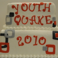 Youth Worship 2010 Yellow cake filled and covered with white almond buttercream. Decorations are made out of fondant.