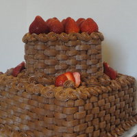 Yummy Chocolate Customers husband was turning 40. She requested yellow cake with chocolate butter cream. Used the basketweave pattern and added...