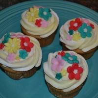Flower Cupcakes These are cupcakes for my daughters birthday. It is pale yellow and white swirl buttercream with MMF flowers.