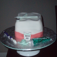 Molar / Tooth I had a lok of fum making the toothpaste, tooth brush, floss and tools. They were all make of gum paste.