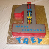 1St Birthday Cake The #1 was cut out of a 1/2 sheet, yellow, double layer cake filled with vanilla buttercream and covered in fondant. All decorations were...