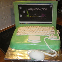 Laptop Cake It's my first cake of that type. Spongecake with orange BC covered with vanilla MMF. Screen made of cardboard.