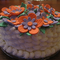Button Flowers Trying out the button flowers - I had only done them in class. This was my sister's birthday cake - dark chocolate with chocolate...