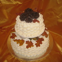 Wilton Tall Cakes Class The tiered cake I made in the Tall Cakes class. Ivory basketweave with chocolate roses and gumpaste leaves/acorns.