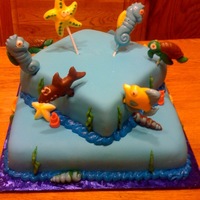 Fishy Cake MMF with buttercream seaweed & borders. Chocolate candy molds for aquatic figures