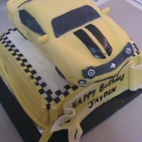 Bumble Bee Camaro Bumble be camaro birthday cake. Car was carved from cake baked in a bread loaf pan and covered in fondant and the bottom is cake is butter...