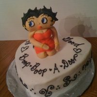 Betty For Mom betty boop cake for my moms birthday. cake is yellow with butter cream. betty is made covering marshmallows with gumpast.
