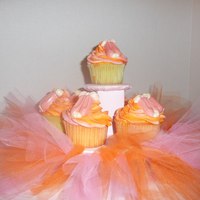 Pink & Orange Ballet Cupcakes The request was for cupcakes for a 3 yr old whose favorite colors were pink and orange and who loved ballet. Tutu on cupcake stand, and...