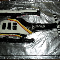 Helicopter Cake This was my first attempt at a figure cake. It's a replica as far as color scheme goes of the helicopter my husband flies in air-...