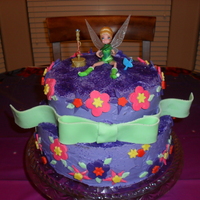 Tinkerbell Cake This was the first ever cake that I tried to decorate. It was for my daughter's 3rd birthday. This was before I had taken the Wilton...