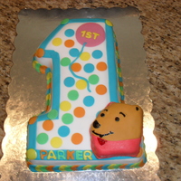 1St Birthday Winnie The Pooh Cake Made to match the plates for the party. The #1 is chocolate cake with BC icing covered in fondant. The Pooh cake is vanilla cake with BC...