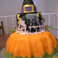 Halloween Birthday pumpkin is yellow with cream filling and strawberries, middle is chocolate with chocolate marshmallow filling..all decorations are fondant...