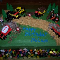 Construction Cake Yellow cake, buttercream icing, everything except the construction items and trees are edible