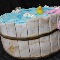 Rubber Ducky Tub This is a tall (10 inch x 2 WASC and 10 inch x2 chocolate) cake, chocolate ganache and buttercream filling. Sides are fondant strips, I did...
