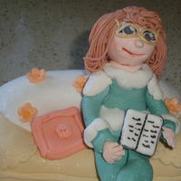 Mum Close Up - Fondant Character - First Attempt first attempt at making fondant people - this one is my mum reading a book. pls let me know what you think...