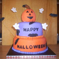 Nephews' Halloween Party 2010 This was for my nephews' Halloween party. 6 and 8 inch round tiers. 6 inch is vanilla cake with cookies and cream filling frosted with...
