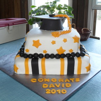 David, High School Graduation, June 2010 Here we have a 2-tier square cake; 10" and 8". The 10" is white cake with buttercream filling, buttercream frosting and MMF...