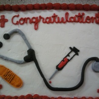 Congratulations decorated with bc, this cake was made for a graduating medical assistant. It features a stethescope, band-aid and syringe...