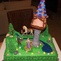 Rapunzel Tangled Birthday Cake I did this cake for my neighbor's little girl. The tower was not very stable... The base of the tower was made of cake filled ice...