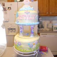 Sent Down From Heaven This cake has a 10" base and an 8" upper tier. Covered with fondant and fondant flowers. The clouds on top are buttercream and I...